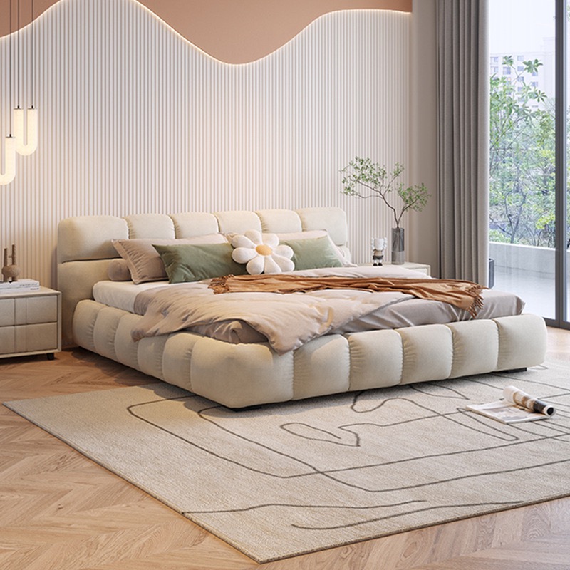 Plush Wave Bed with a curved upholstered headboard